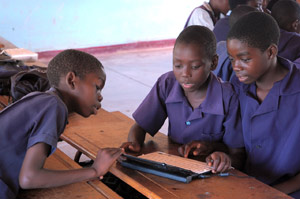 Group of boys working with laptop