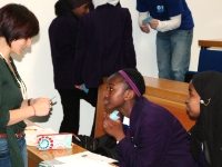 discussing EAL science with students at Norwood School