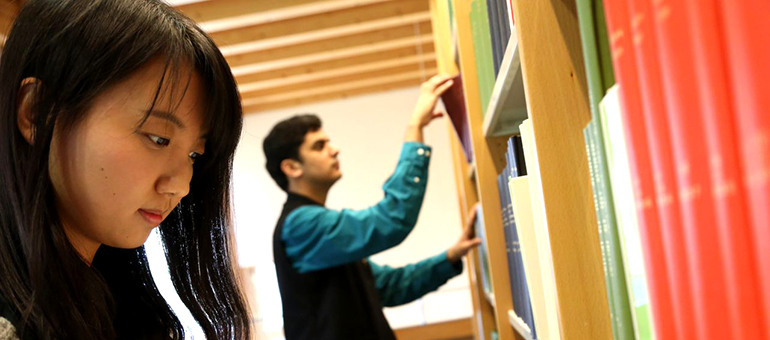 Male and female students in Library