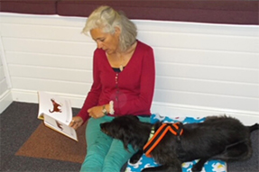 Deborah Neame with reading dog
