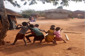 Children playing outside in a poor village, Malawi