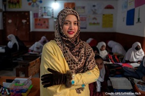 Female teachers stands in classroom, Pakistan