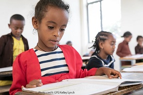 Girl sits at her desk in a primary school classroom, Ethiopia