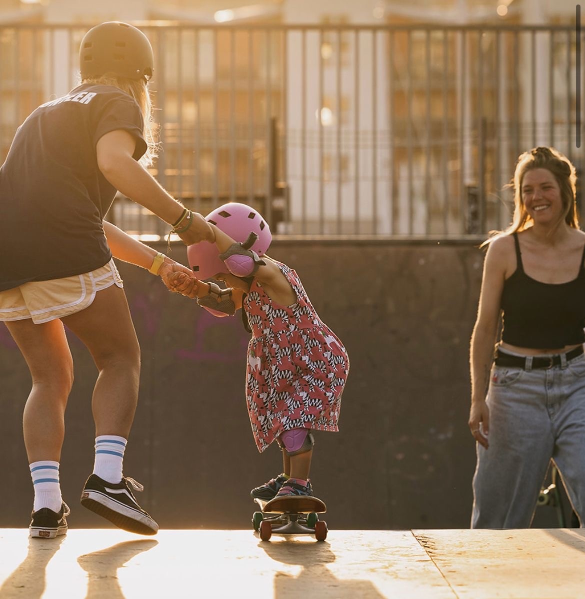 Child skating with adult
