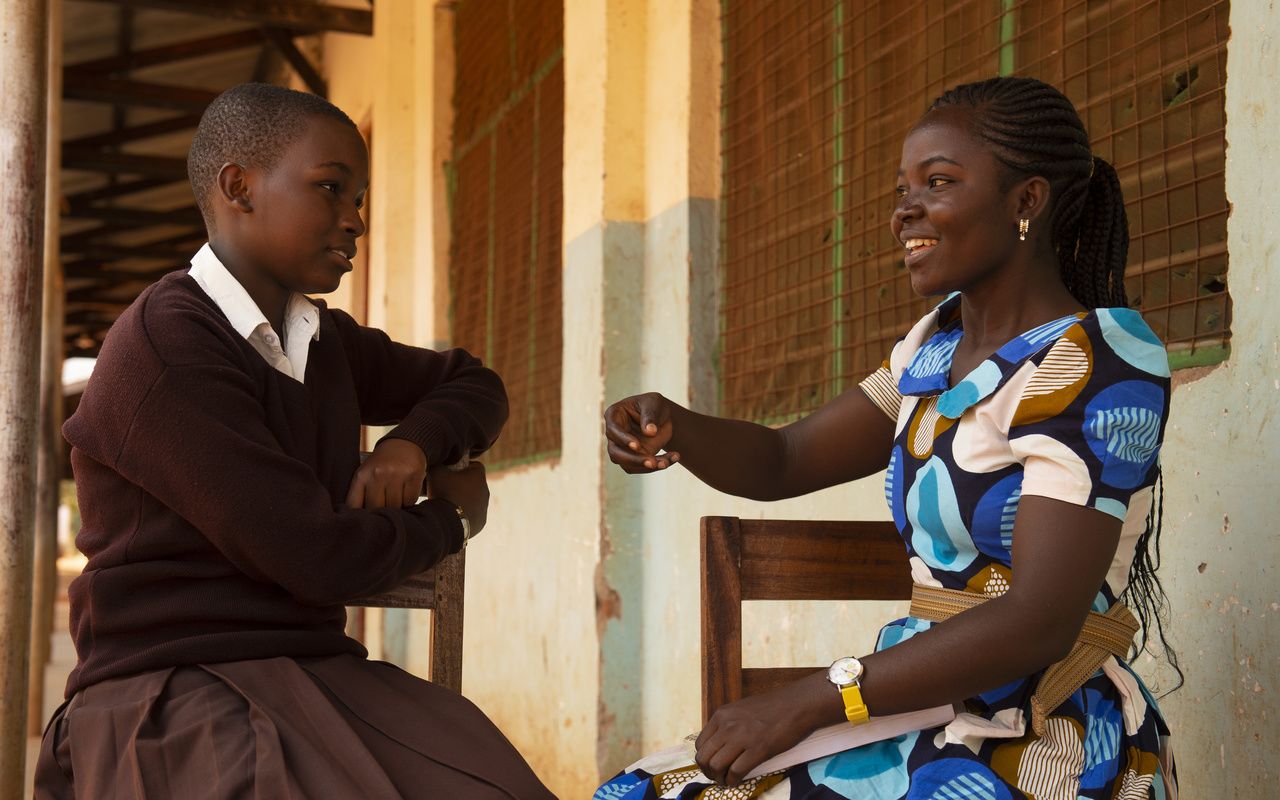 Sophia (right), a CAMFED Learner Guide, with secondary student Hanipha, who she supports at school. 