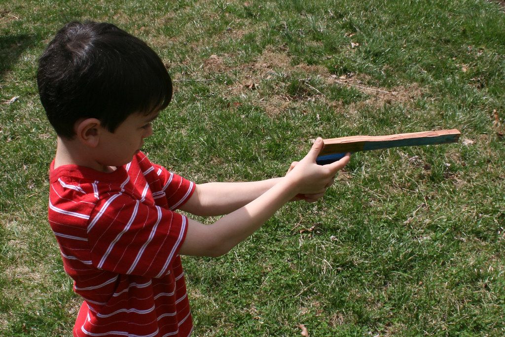 Boy with toy gun