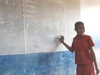 Child at blackboard in Tanzania