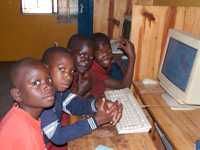 Children at computer screen in Tanzania