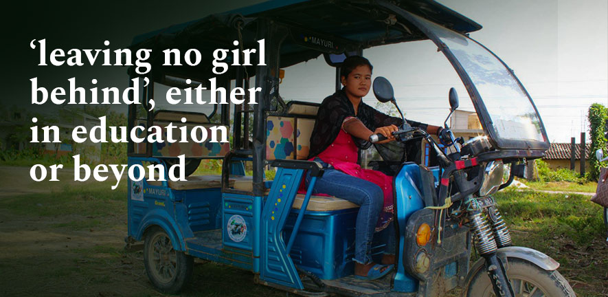 Young girl in Nepal driving a motorised rickshaw