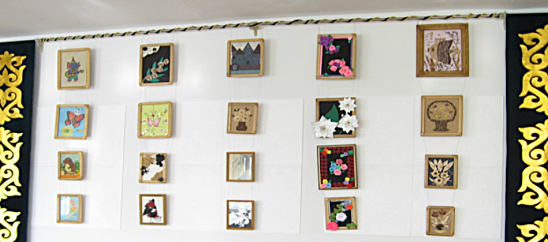Wall hangings and school craft pictures on wall