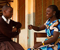 Sophia (right), a CAMFED Learner Guide, with secondary student Hanipha, who she supports at school.