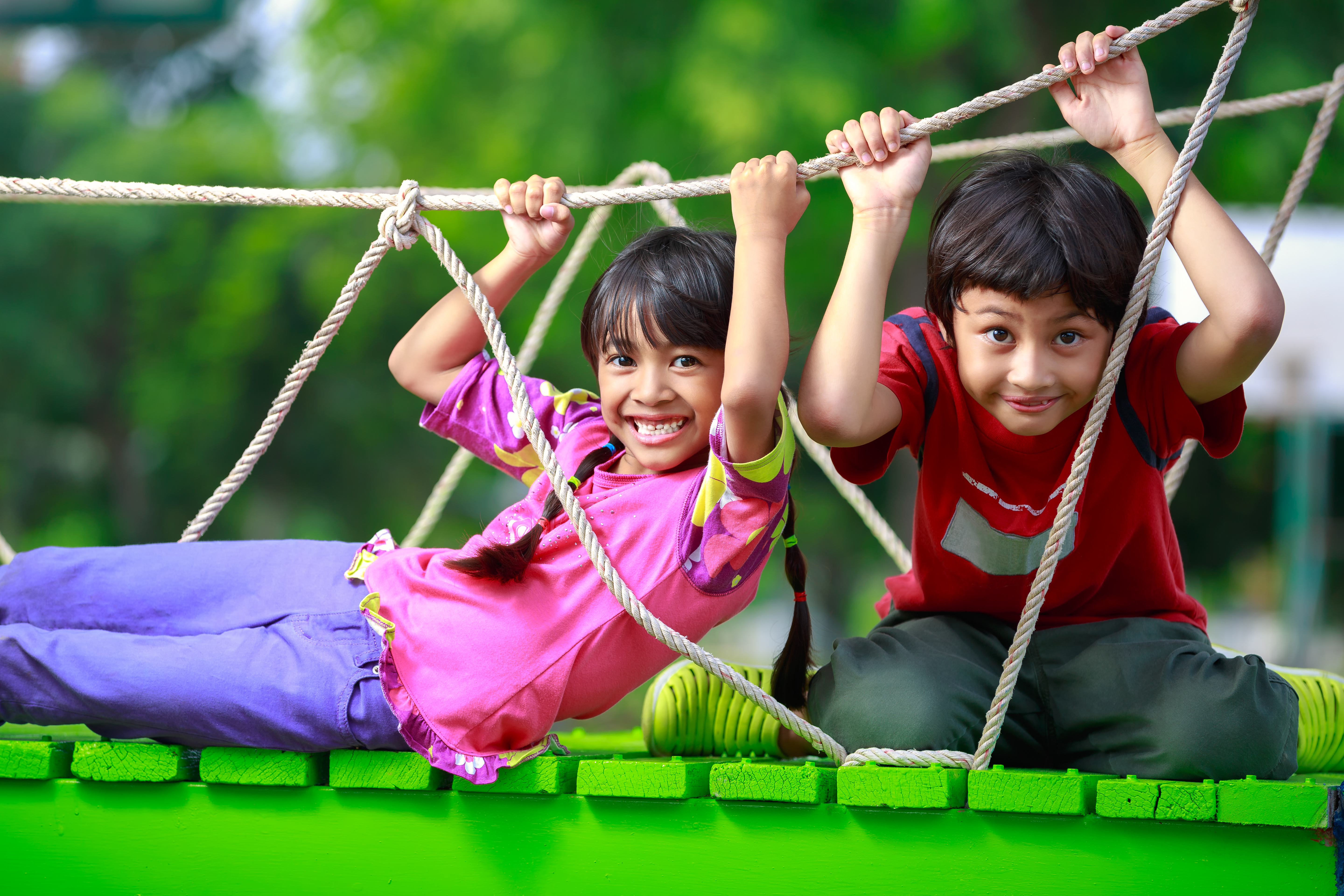 Children playing with rope pedal play