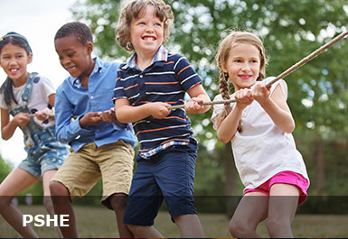 Four happy healthy looking children pulling a rope