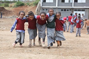 Happy girls in school playground at Hidassie School, Addis Ababa, Ethiopia