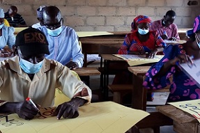 Teachers creating signs in classroom, Adamawa, Nigeria