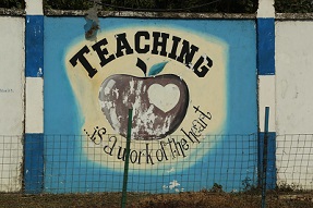 Sign on teacher training college wall: Teaching is a work of the heart