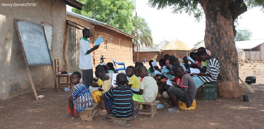 Children being taught in an outdoor classroom in northern Ghana