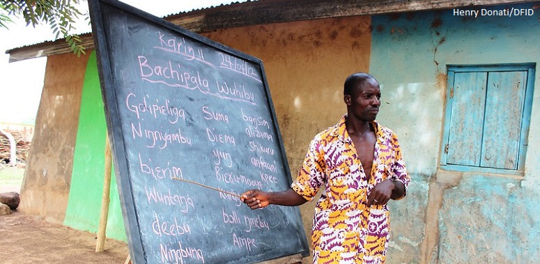 A teacher at an outdoor blackboard in northern Ghana