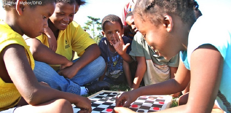 Children playing a board game, South Africa