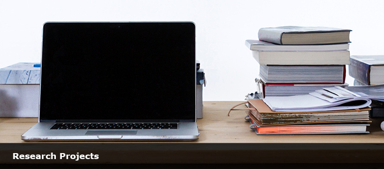 Laptop and books. Photo by freddie marriage on Unsplash. Copyright free.